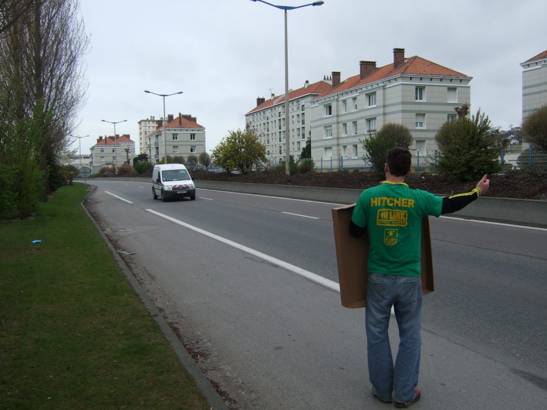 Cat's partner hitchhiking on their travels