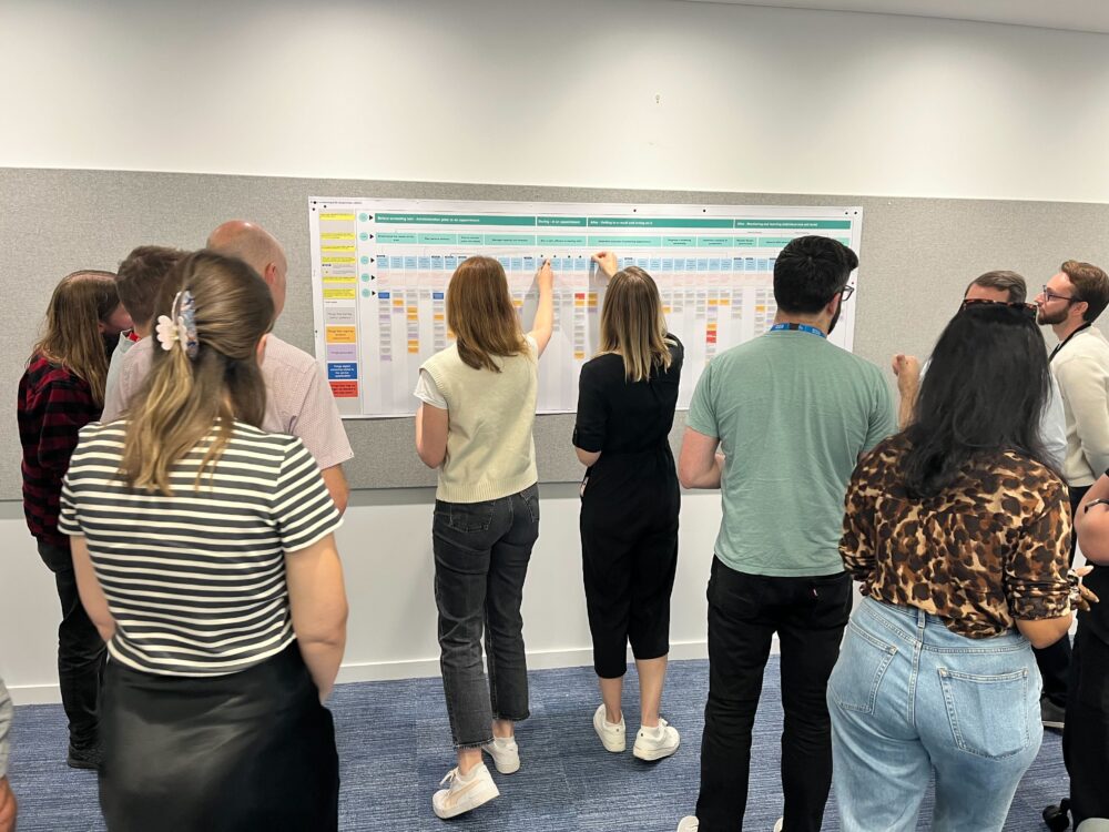 group of people together in the nhse office
