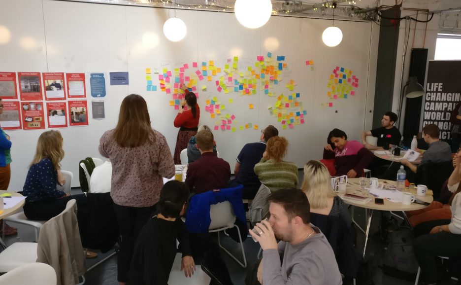 Facilitators sorting the themes from the ideas session