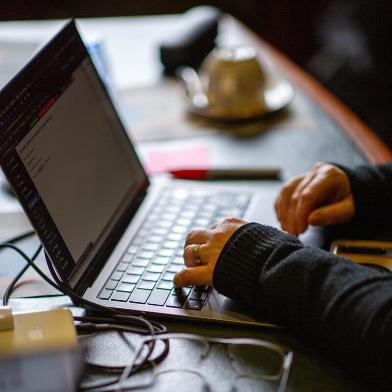 Person typing on a laptop