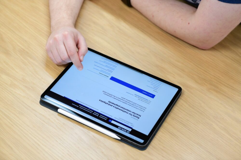 A person using the service on a tablet