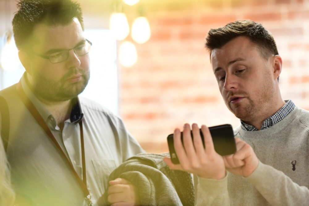 2 people looking at a mobile