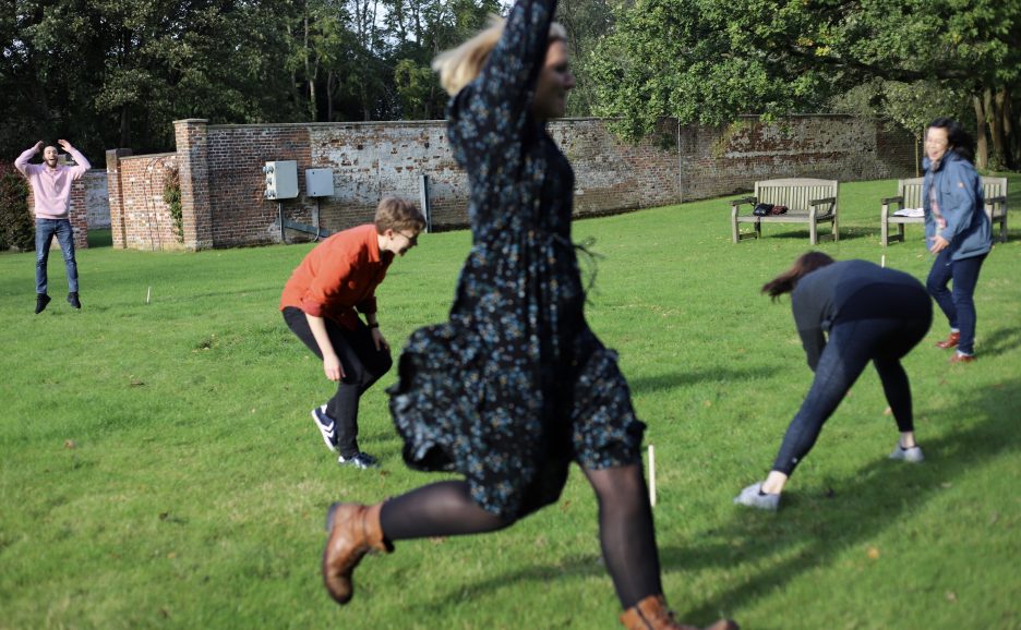 Some of the staff playing rounders